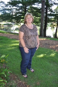 Paula Darby outside in a cheetah print shirt.