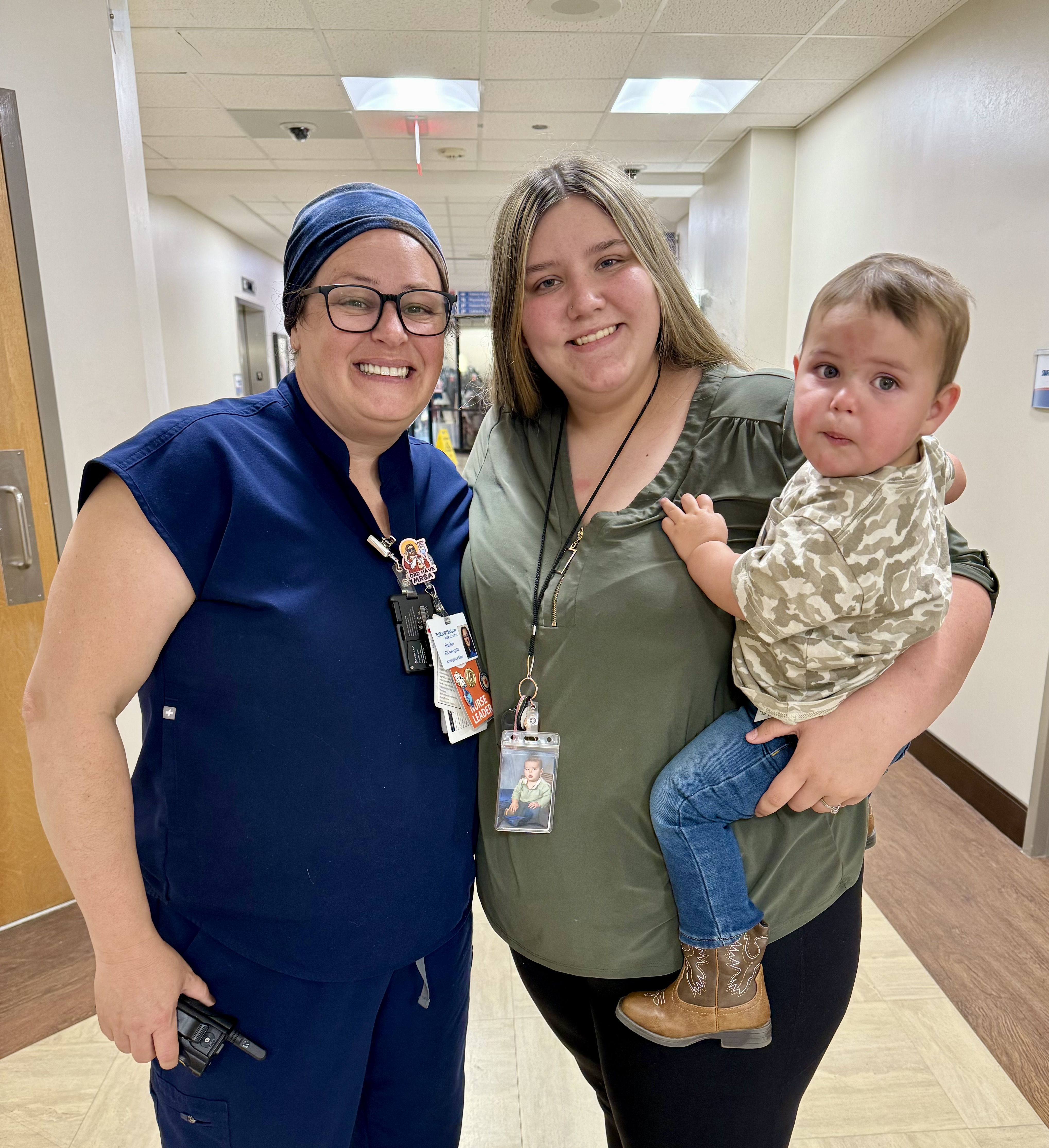 Rachel, Sarah, and Sarah's son smiling for a photo.