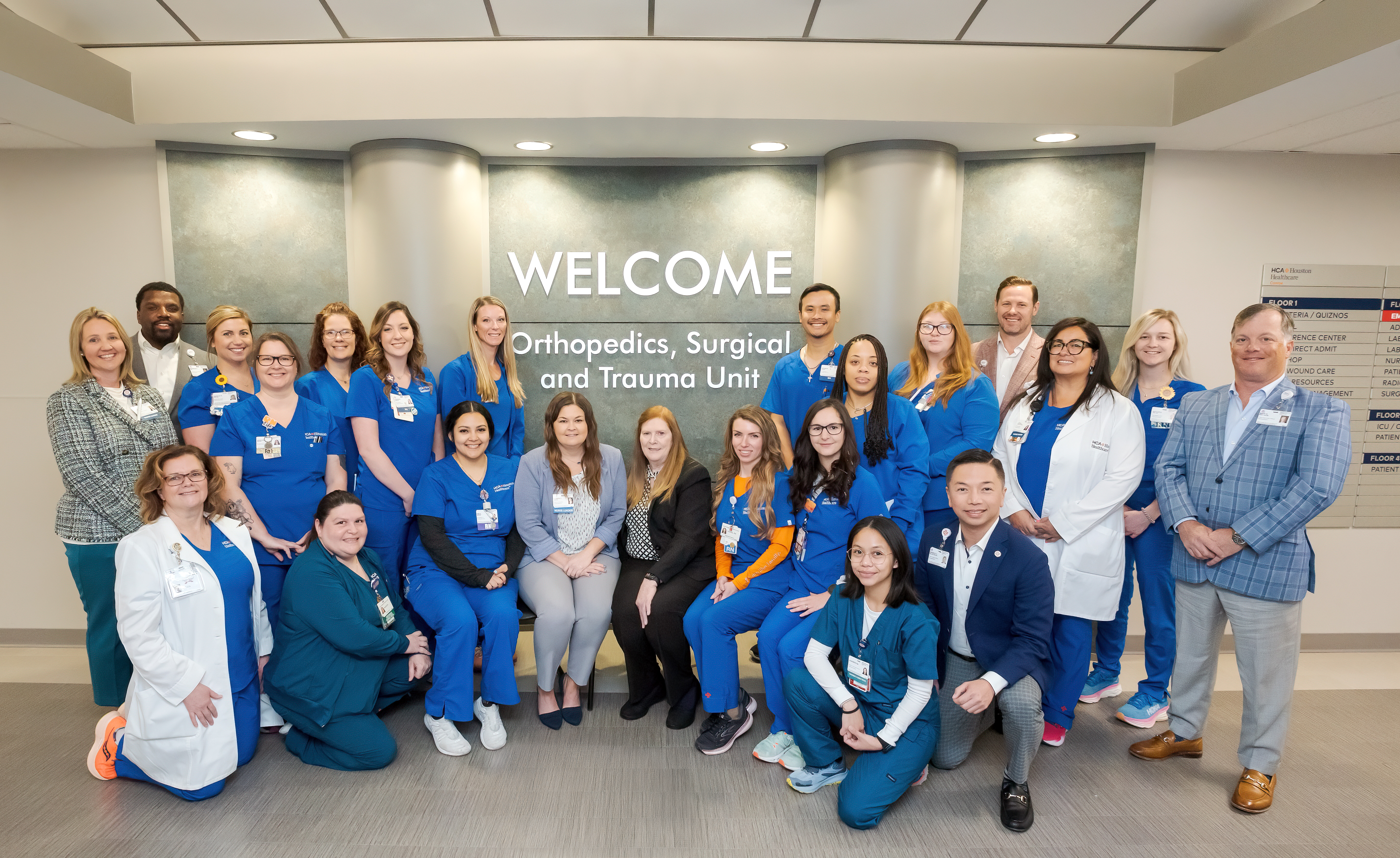 Conroe's Orthopedic/Trauma Unit posing in front of unit sign
