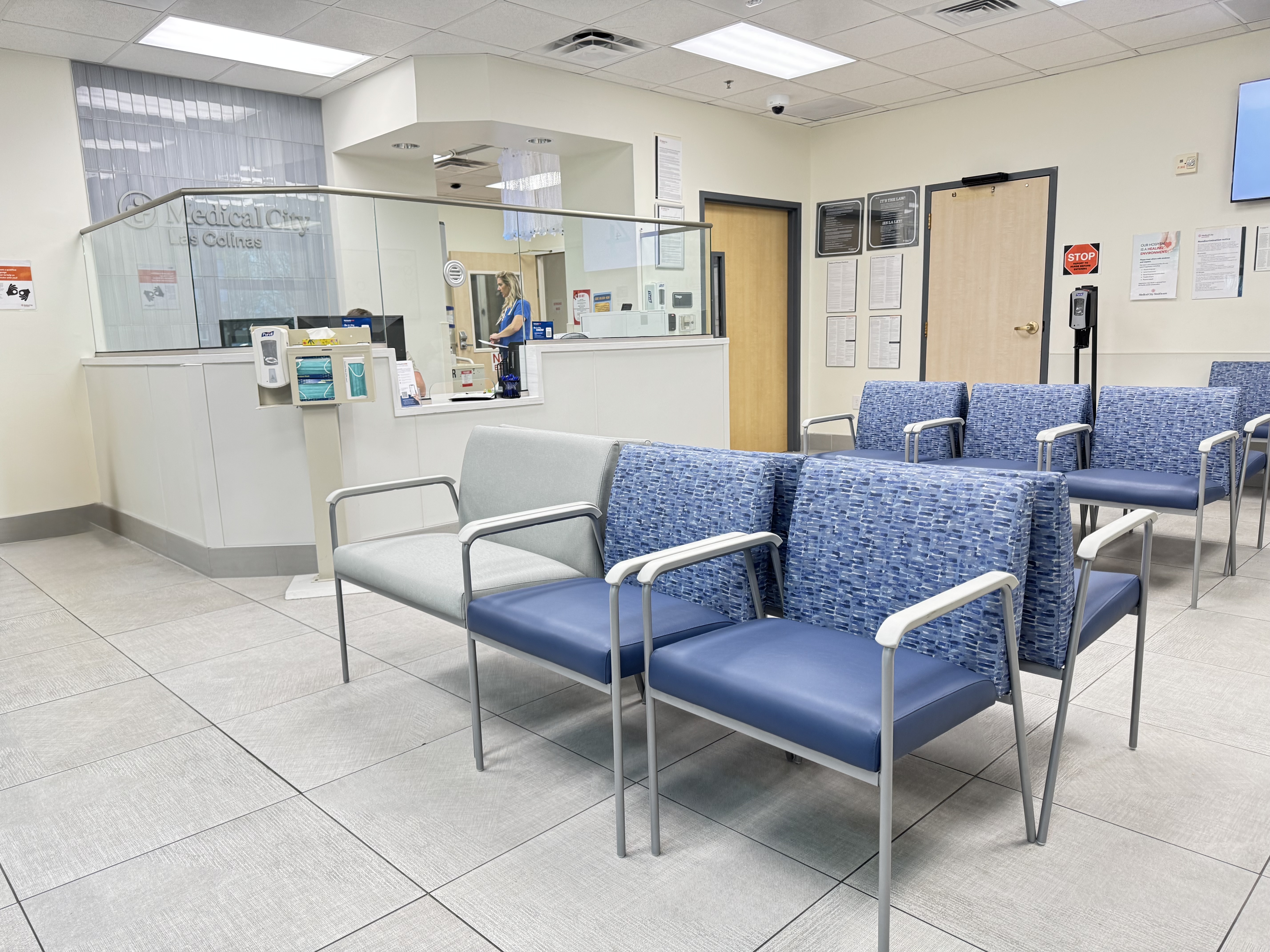 Waiting room with intake desk and seating.
