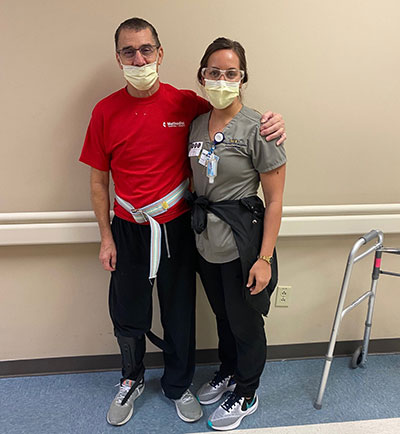 Terry Chaffee standing with a nurse.