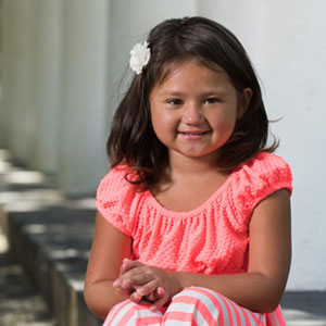 Jadelyn Sanchez smiling and wearing a pink dress.