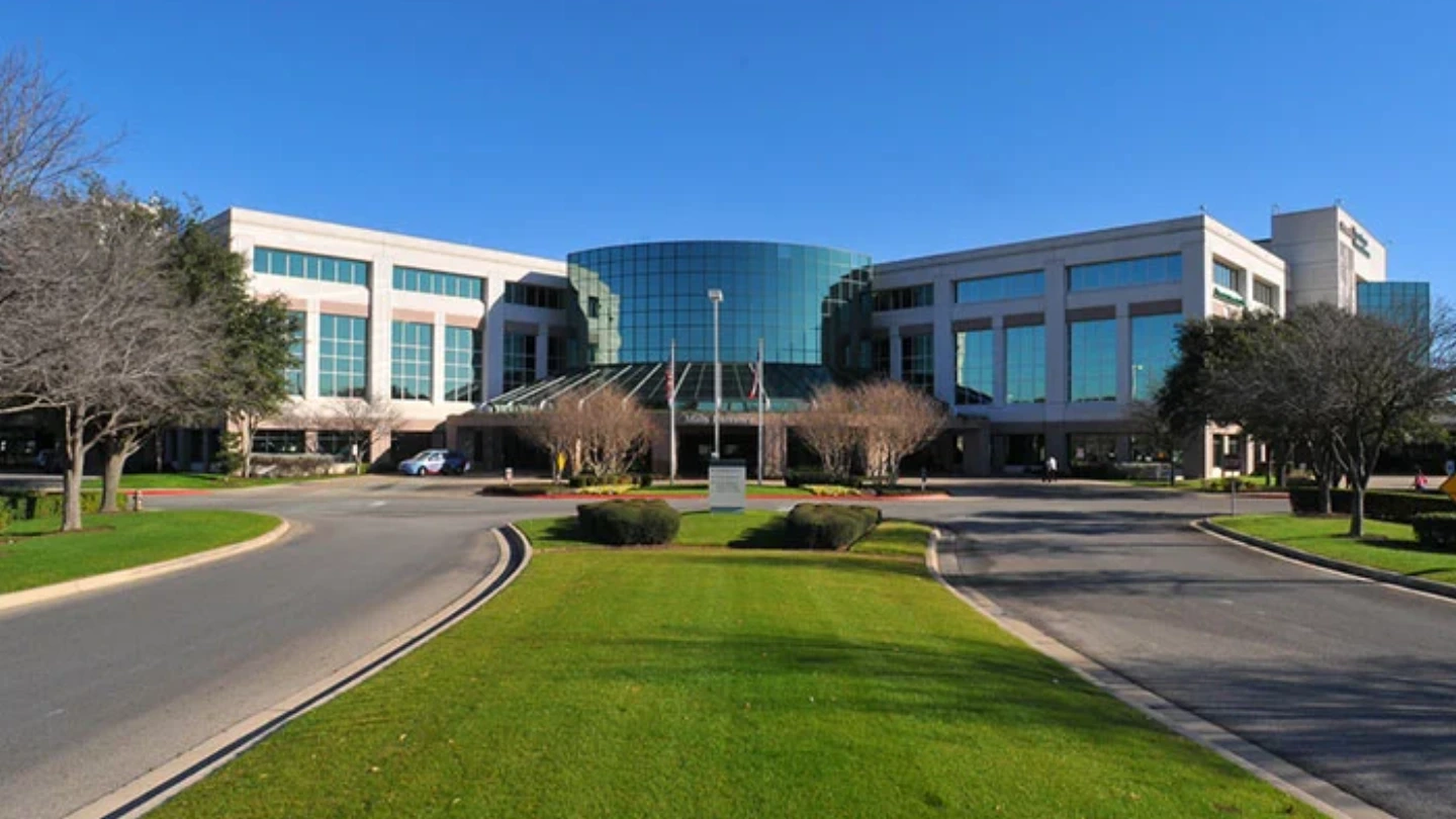 Exterior main entrance to St. David's North Austin Medical Center on a sunny day.