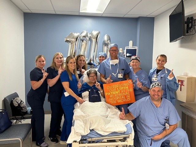 Dr. Tobias Carling, board-certified Adrenal Surgeon, celebrates the 1,111th adrenal surgery procedure with the patient and surgery team at the Hospital for Endocrine Surgery.