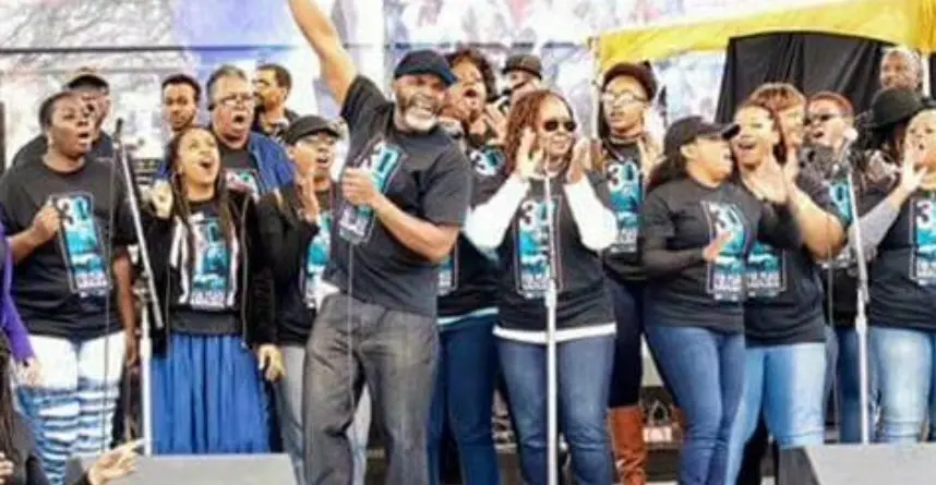 Jerome Roberson with group on stage.