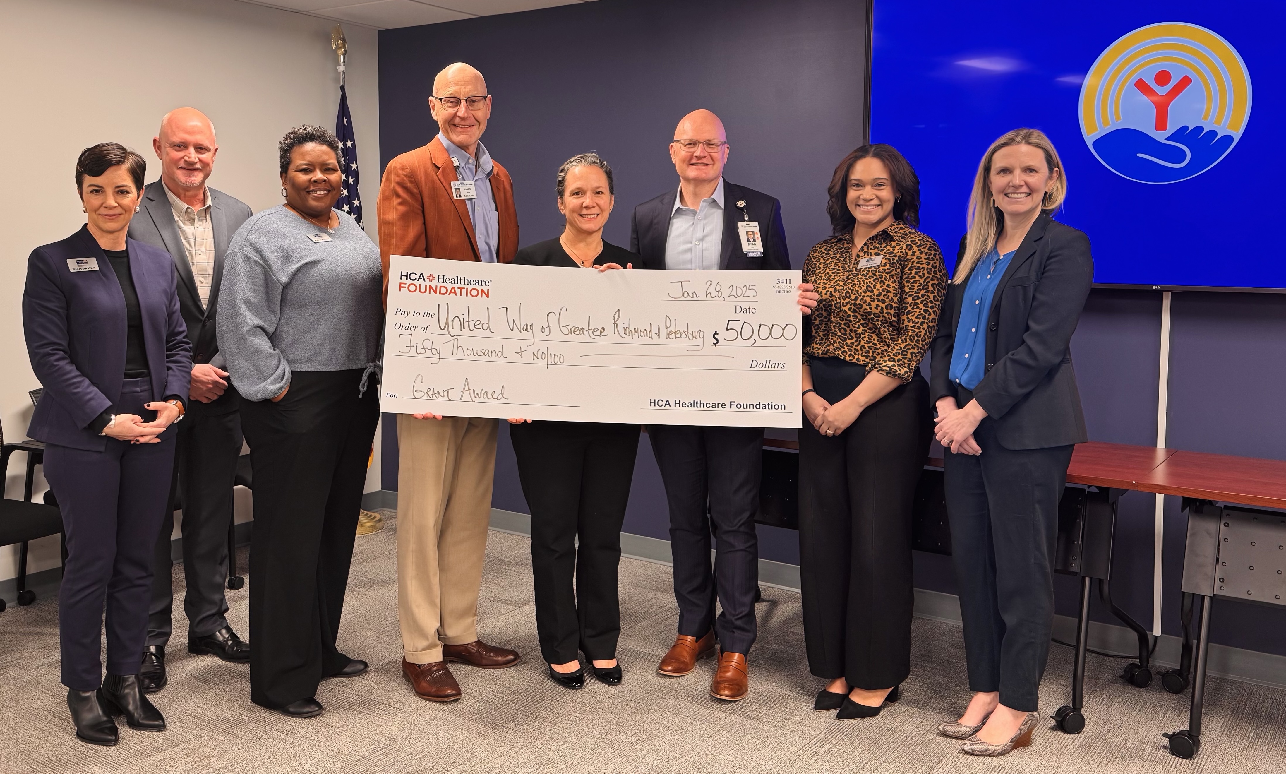 HCA Virginia and United Way representatives pose with $50,000 donation check.