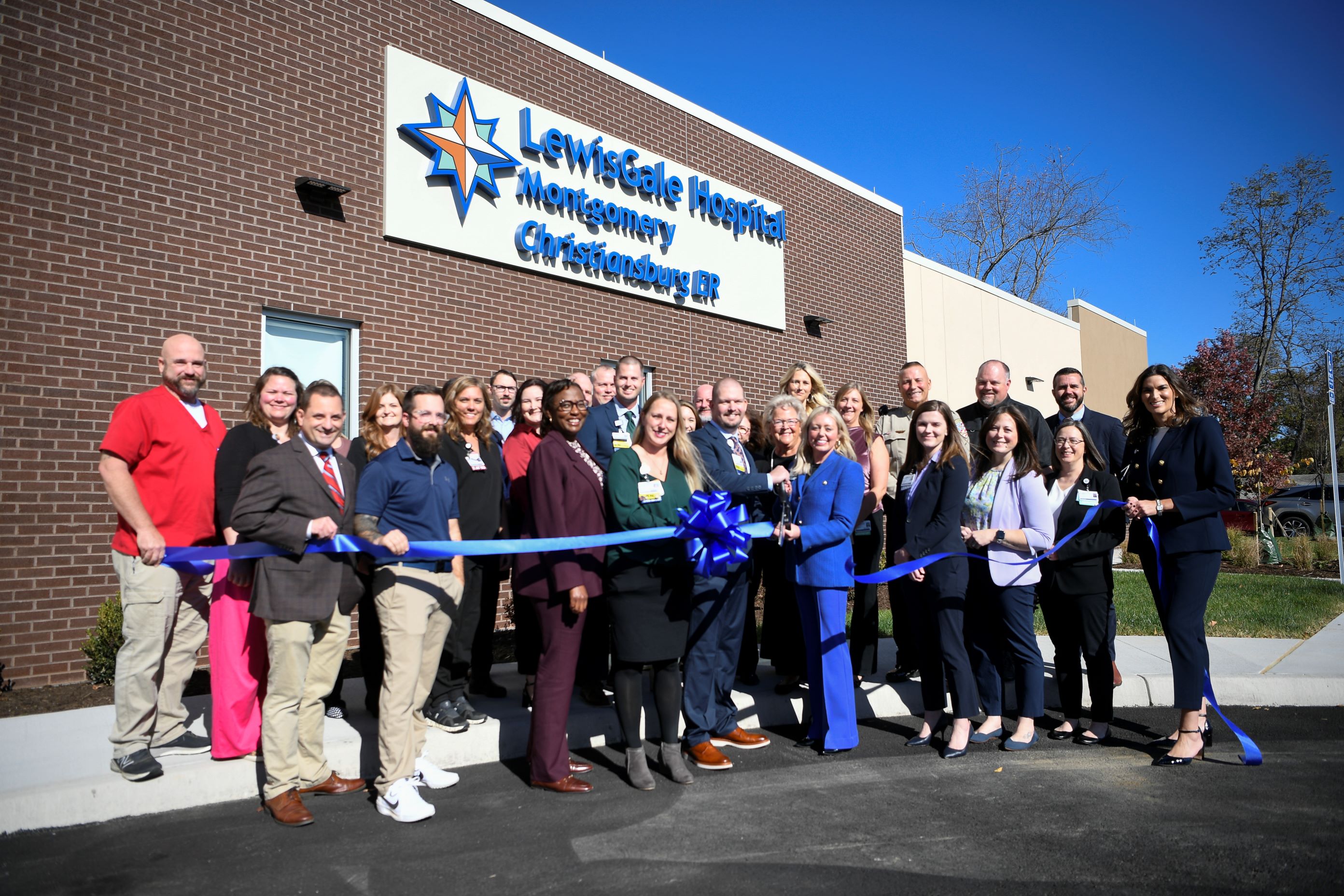 Hospital leaders and local community partners gather for a ribbon cutting on Thursday, Oct. 31.