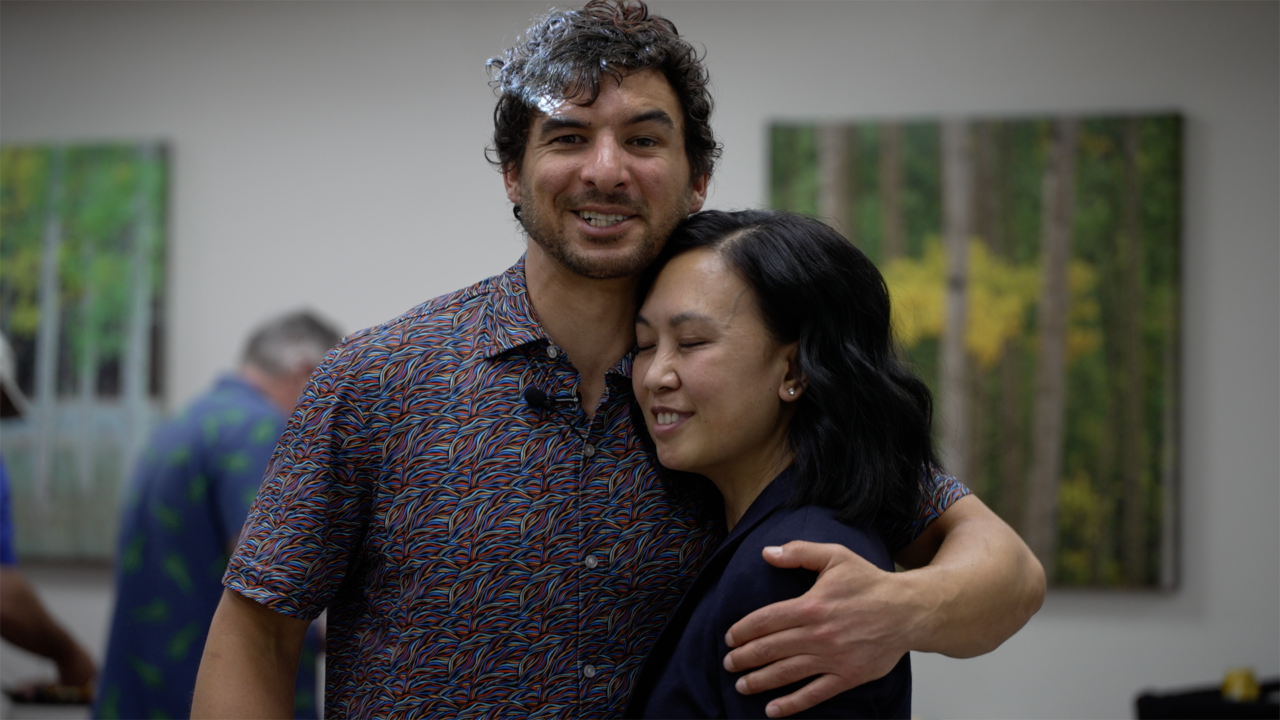 Photo of Ethan and Quan embracing.
