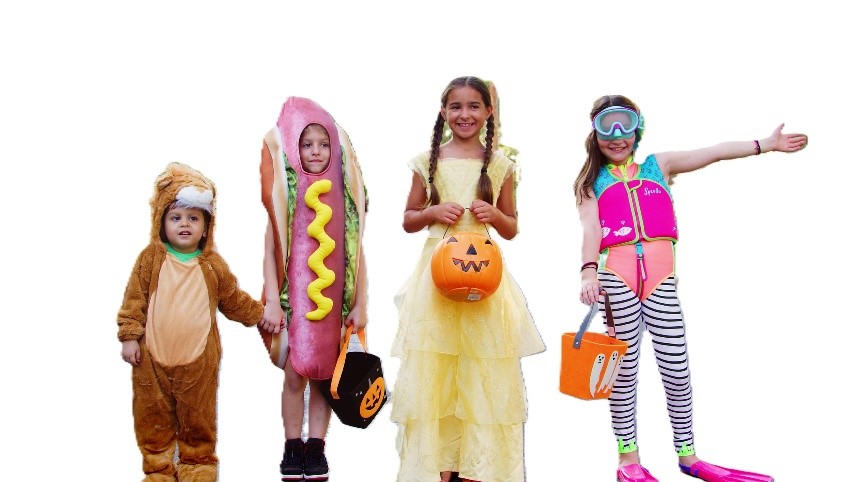 Four children wear Halloween costumes. From left to right, a lion costume, a hotdog costume, a princess costume and a scuba diver costume.