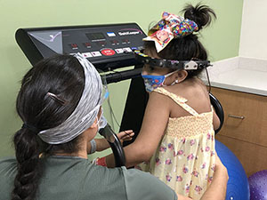Anabela Salas walks on the treadmill during her daily rehabilitation therapy.