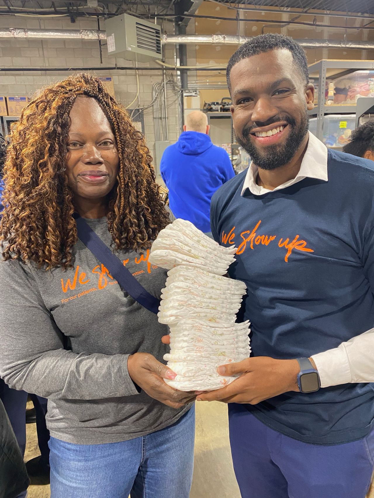 Omar Magee, chair of the HCA Capital Division Black Colleague Network, and Christine Fuselier, director of culture and values, at a community diaper drive on MLK Day of Service.
