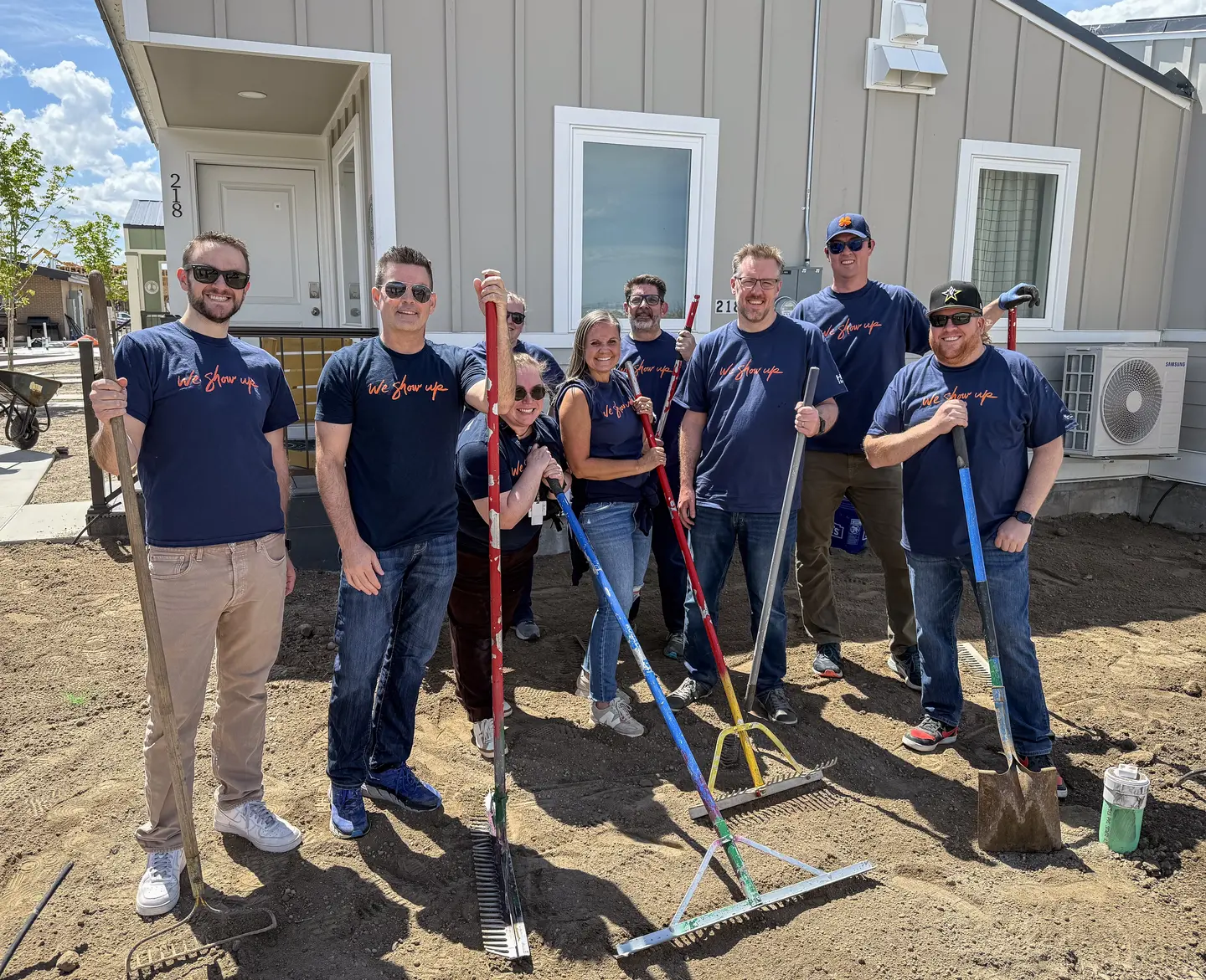 A group of Mountain Division colleagues volunteer at The Other Side Village.