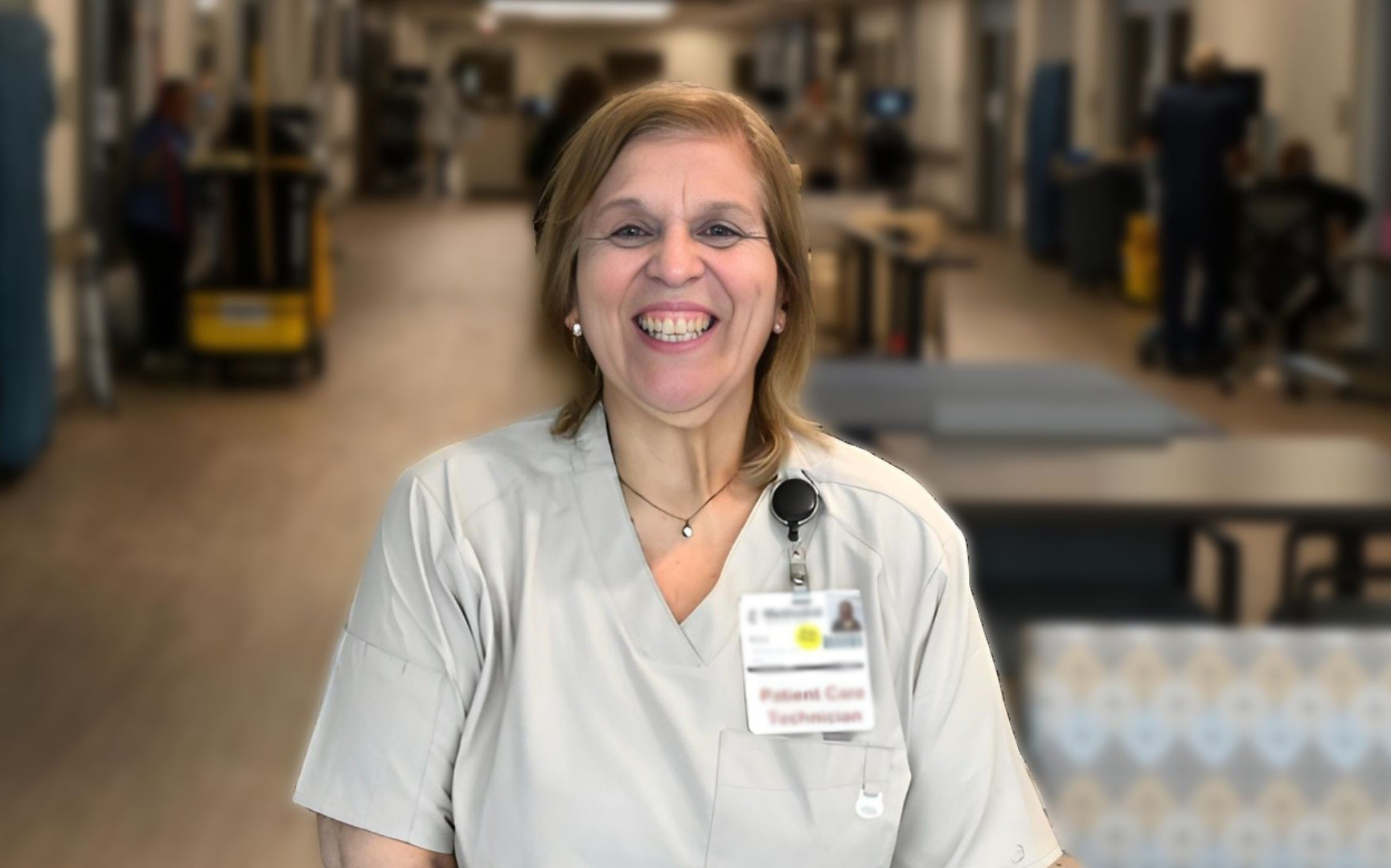 Lisa Rodriguez, a patient care technician at Methodist Hospital Texsan, smiles for a portrait inside the hospital.