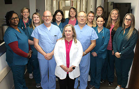 Colleton Medical Center Labor and Delivery staff members pose for a picture in a hallway of the hospital.