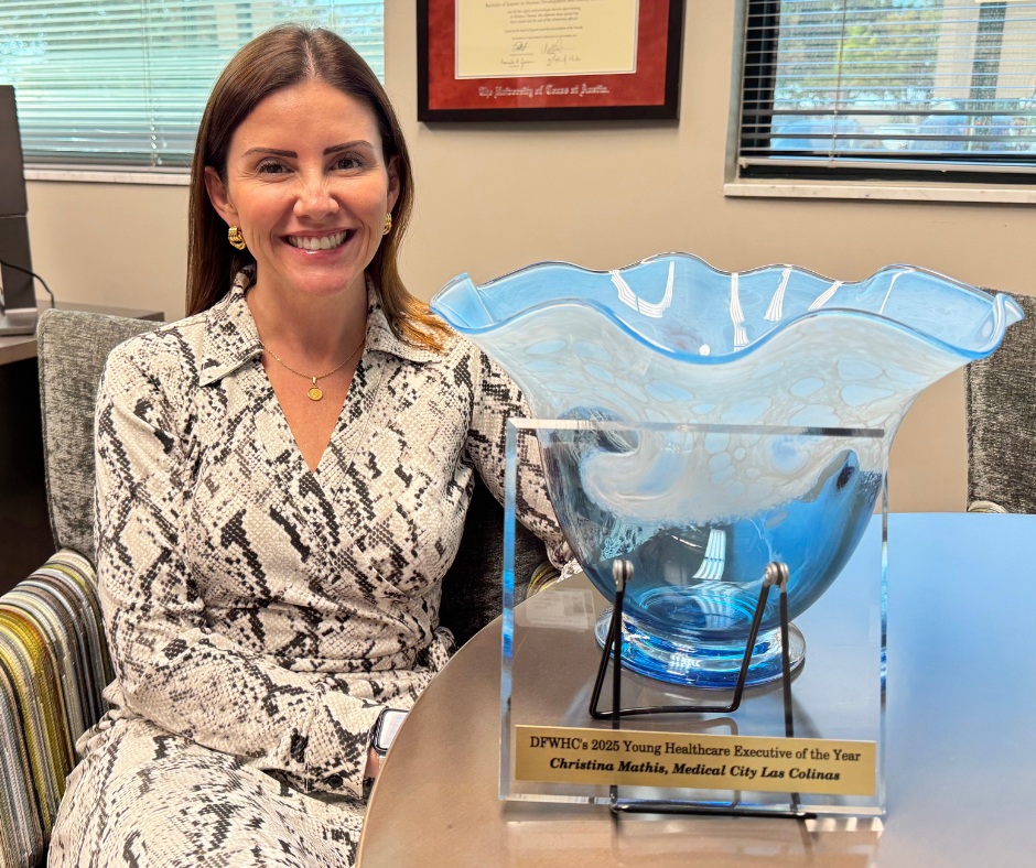 CEO Christina Mathis with the Young Executive of the Year award.