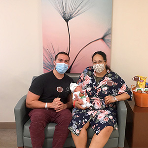 Krystal G. and husband with their newborn.