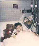 Young David Dow in a hospital bed after his stroke.