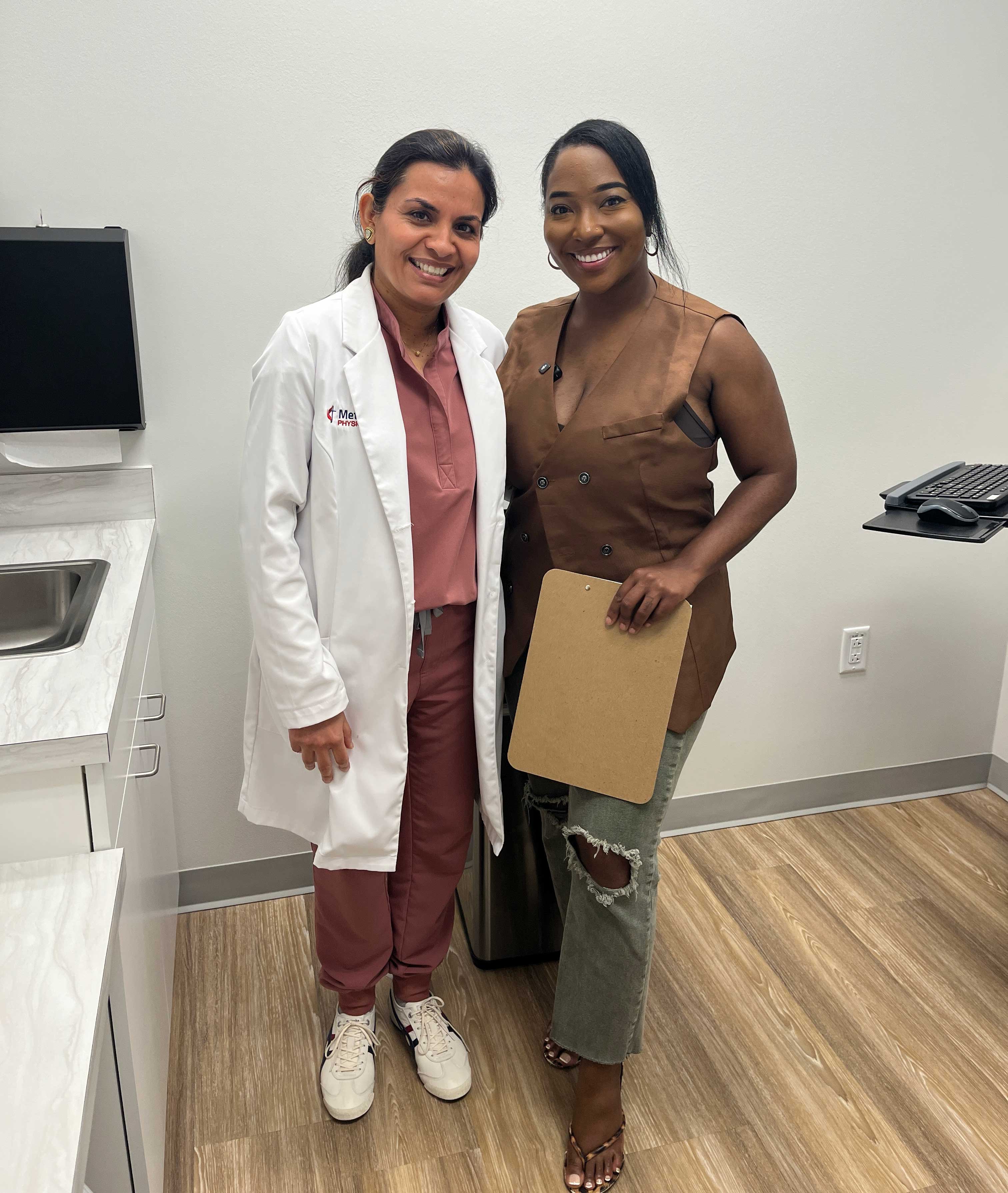 Dr. Dutta from Methodist Hospital Stone Oak smiles with a KSAT news anchor after a segment discussing common PCOS myths.