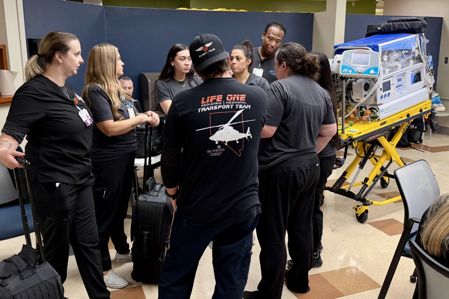 The team learns about the transport patient bed.