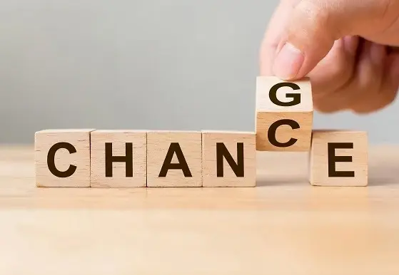 Blocks that spell "Chance" and "Change", with a tilted 5th block that shows both C and G on visible sides