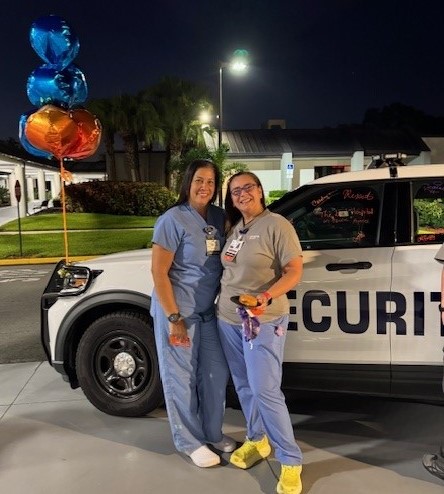 Two of our colleagues from South Tampa Hospital with the security vehicle.