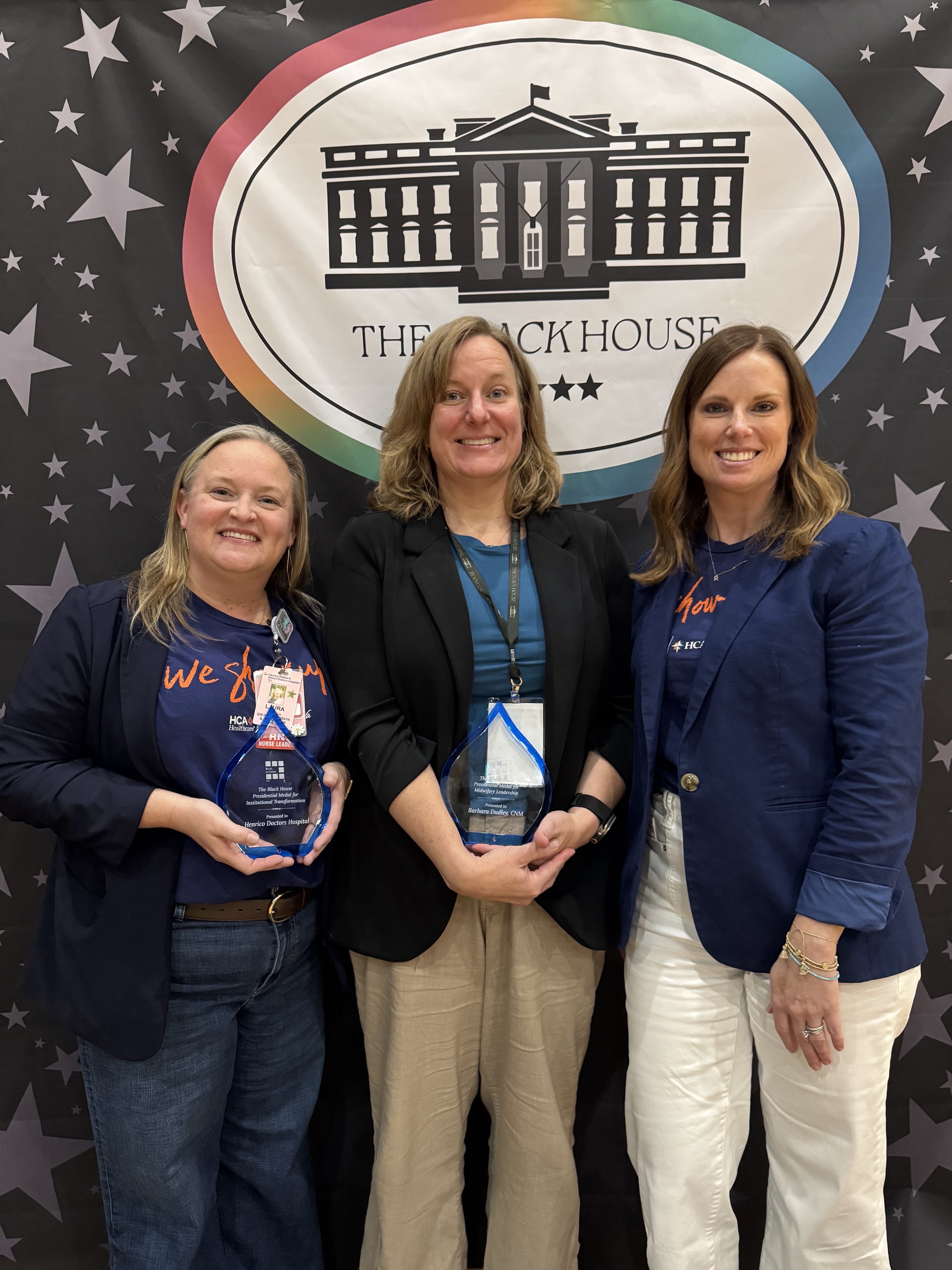 Henrico Doctors’ Hospital’s labor and delivery program team holding the Black House Presidential Medal for Institutional Transformation Award