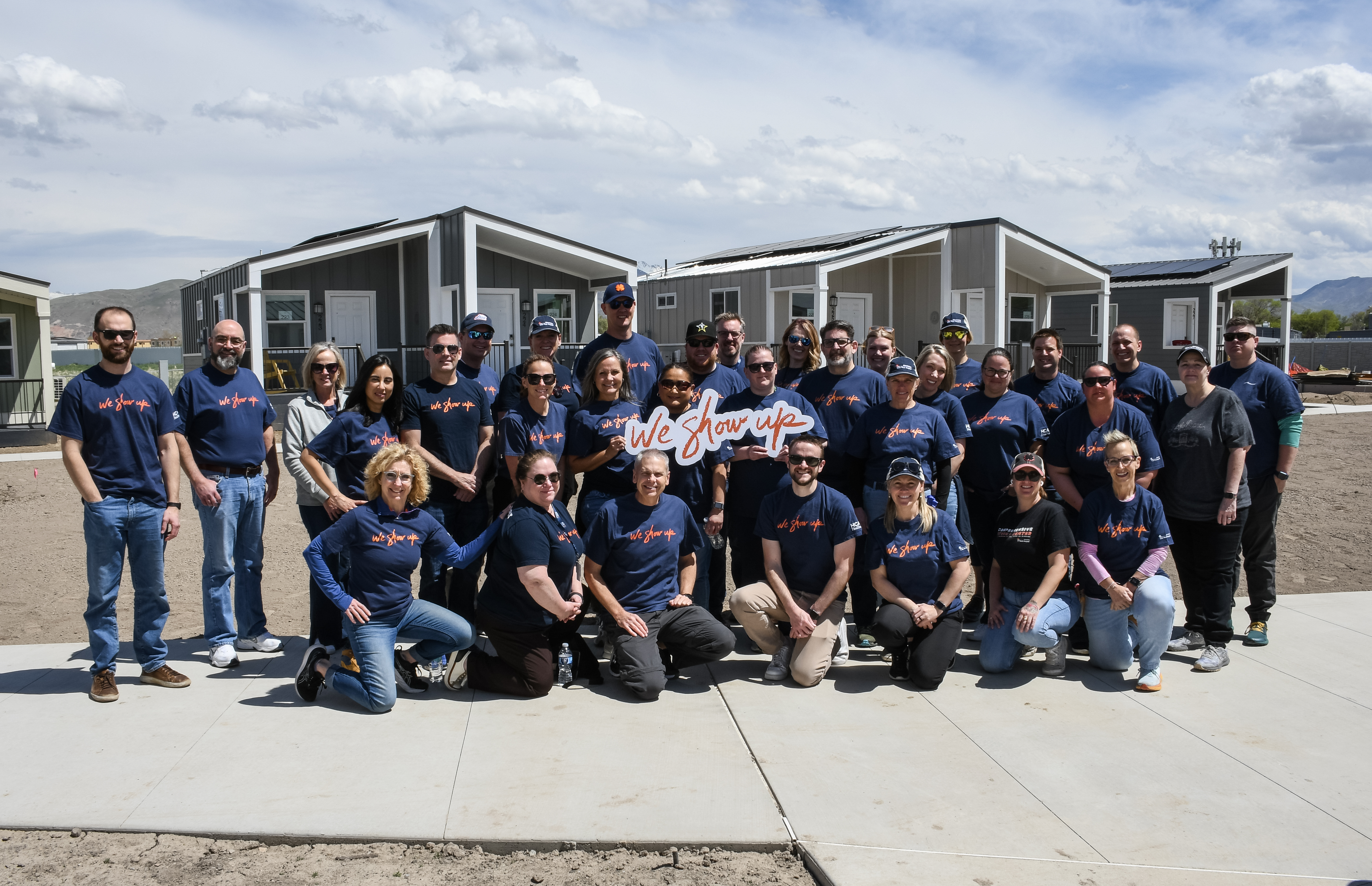 A large group of Mountain Division colleagues volunteer at The Other Side Village.