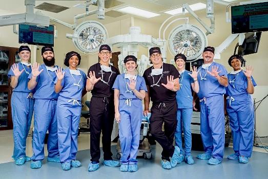 The surgical team is advancing care with advanced robotic system. 