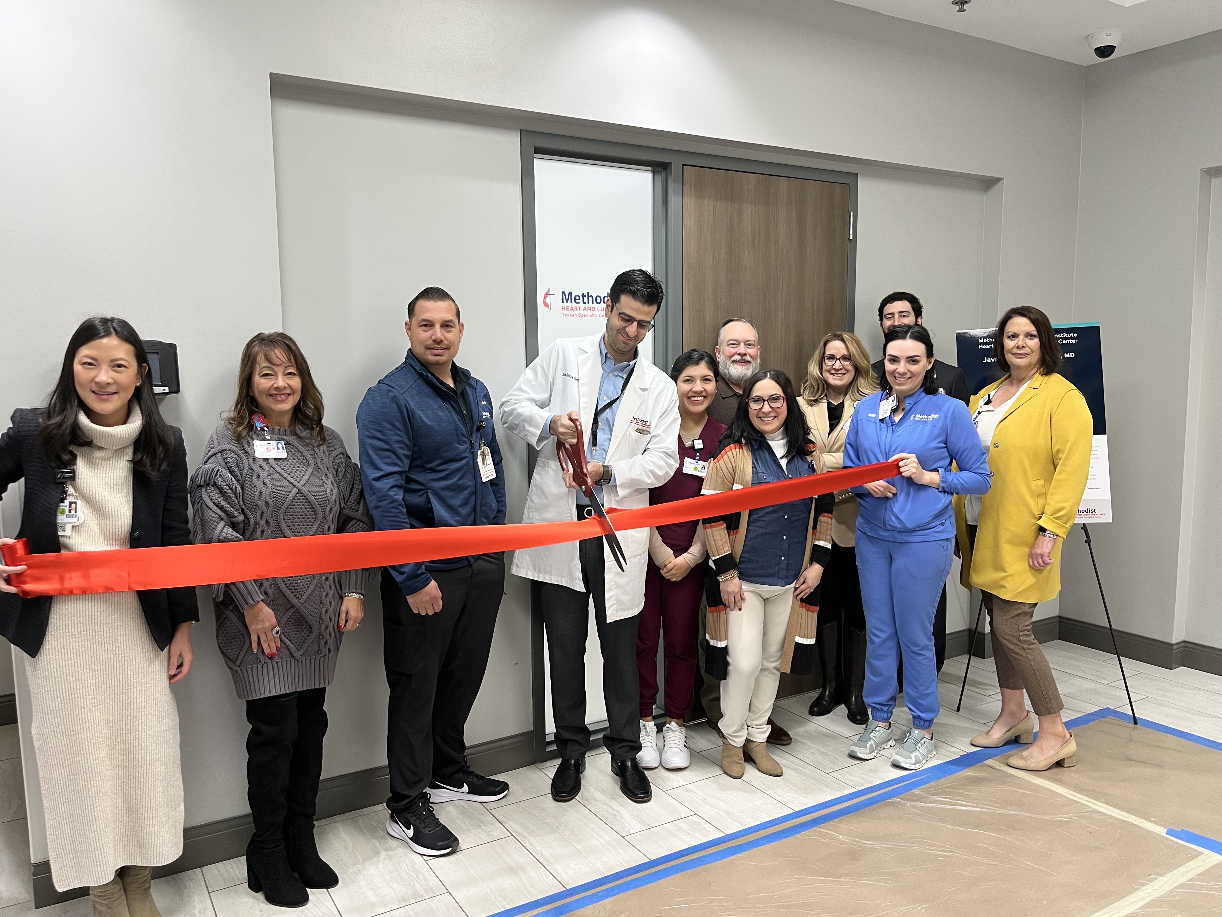 Senior leaders, staff and the lead physician at the ribbon cutting ceremony.