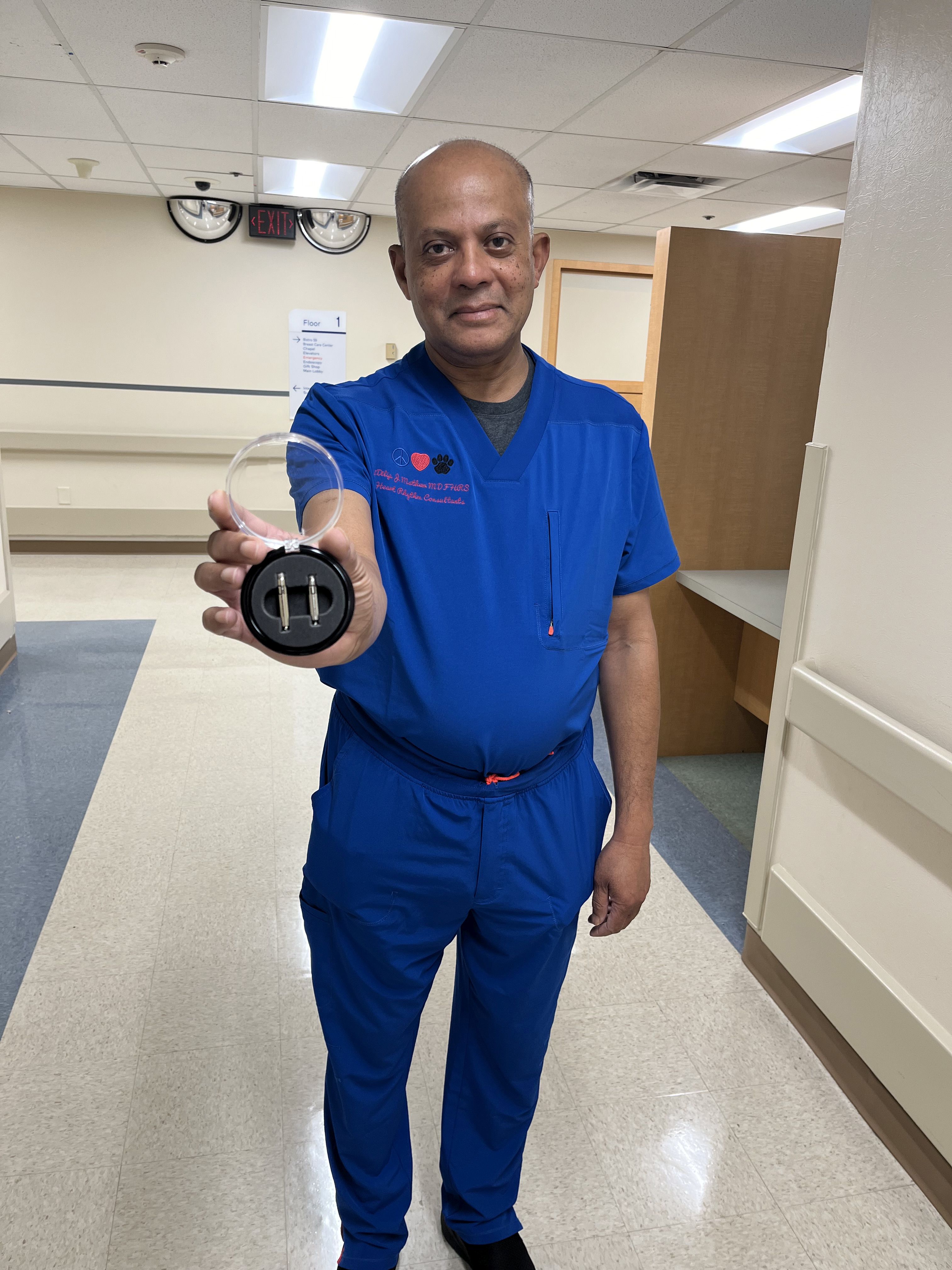 Dr. Dilip Mathew displays the new dual chamber leadless pacemaker now offered at HCA Florida Blake Hospital.