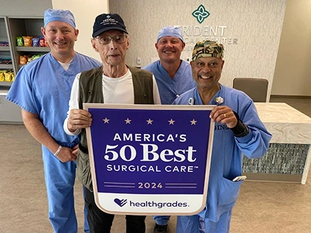Brian Evans, VP, Surgical Services, Dr. Robert Blackard, founding member of Trident Medical Center's medical staff, David Mizzell, Director of Surgical Services, and Gino Lobo, Biomedical Technician