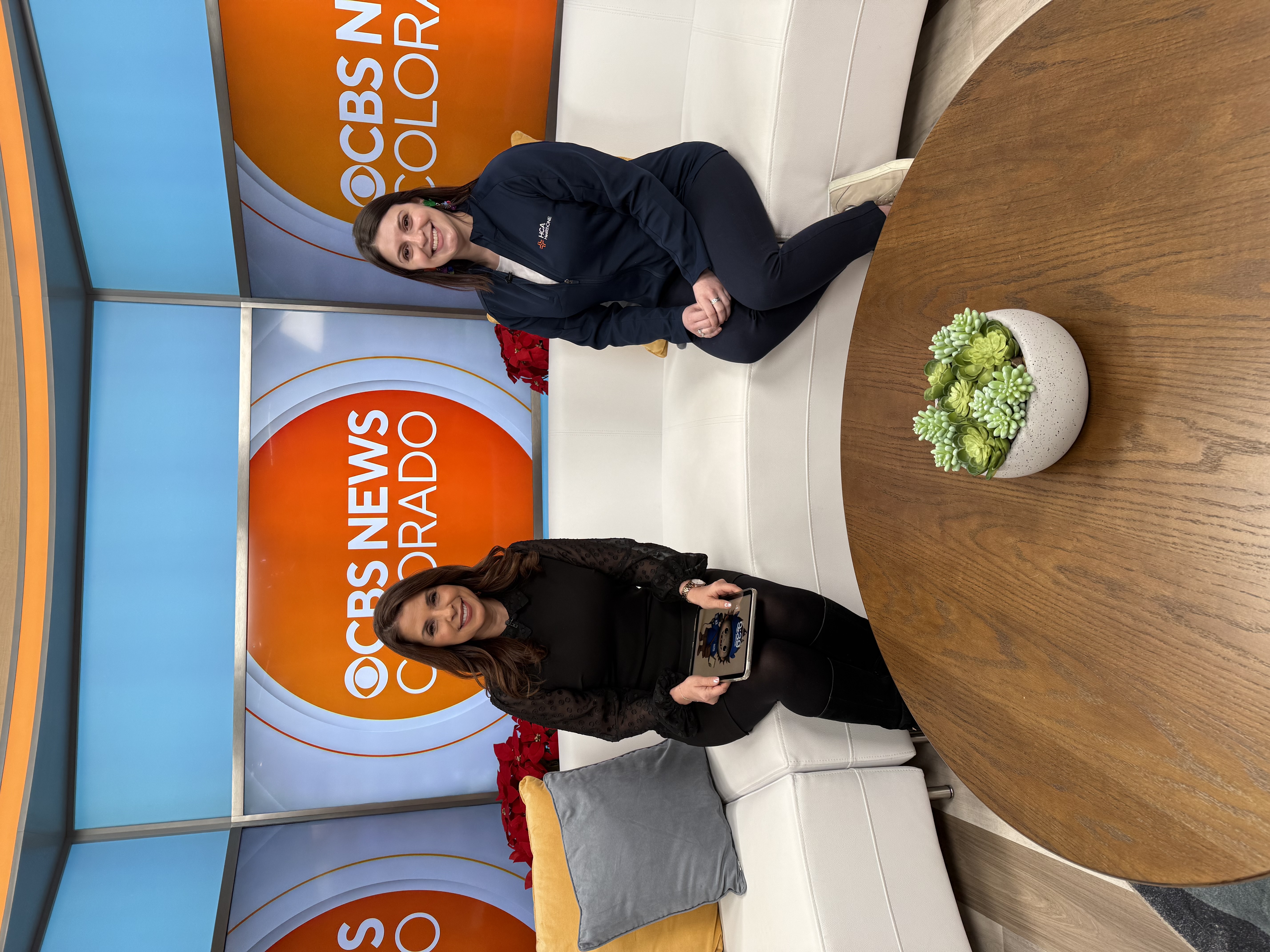 Two news anchors on set.