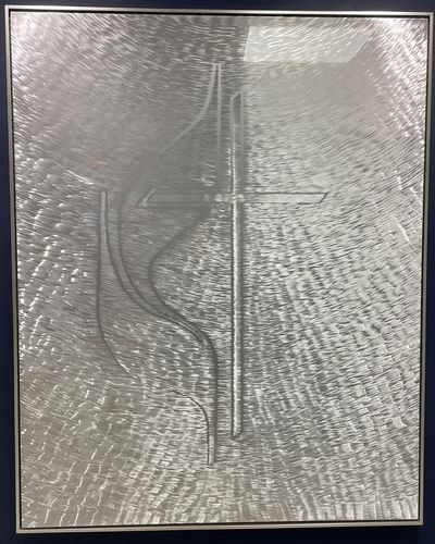 A commissioned work of art by local artist, Eric Breish, called “In Service of Others,” made out of aluminum with a varnish top coat.