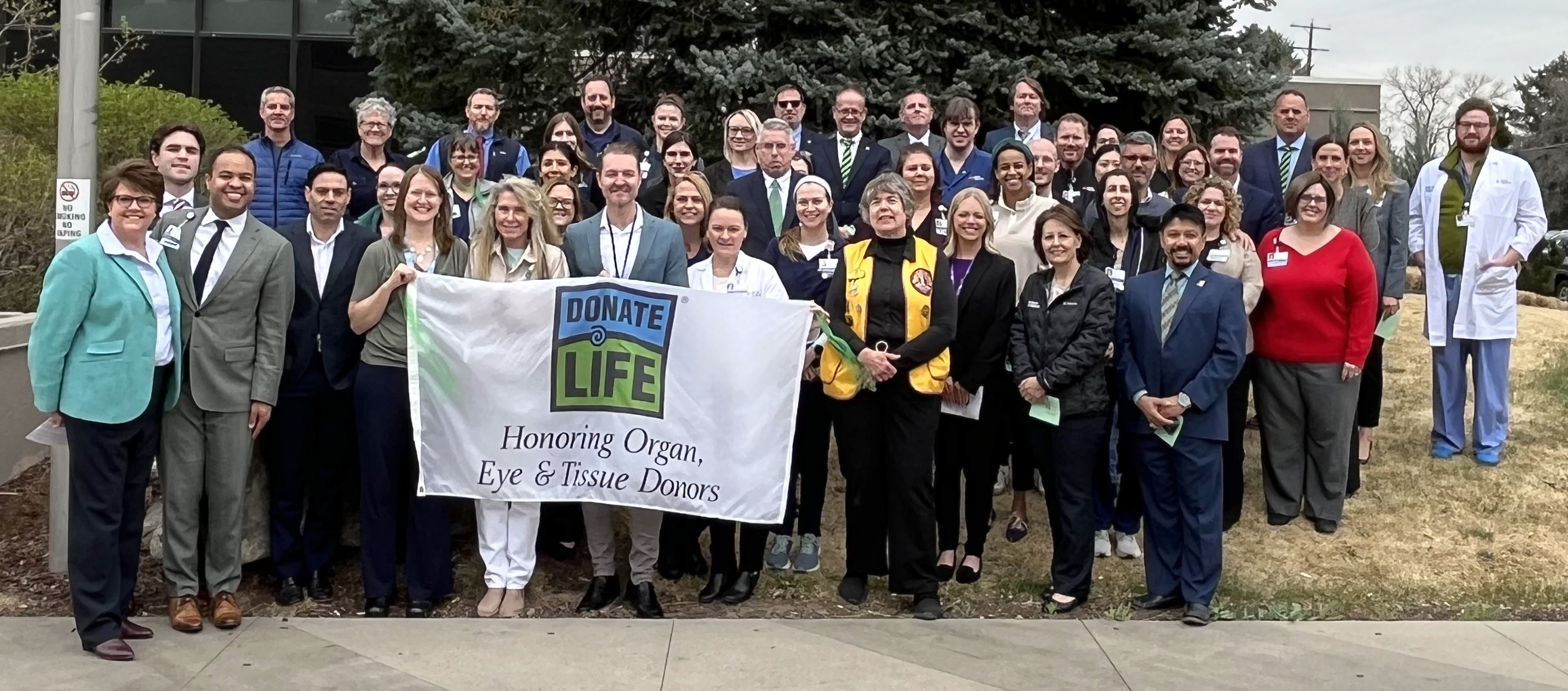 The HCA HealthONE Presbyterian St. Luke's team gathers for the annual flag raising ceremony to kick-off Donate Life Month.