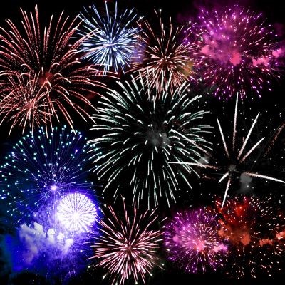 Red, white and blue fireworks at night.