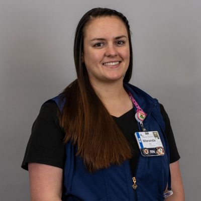 Maranda Kealamakia wearing nurse scrubs.