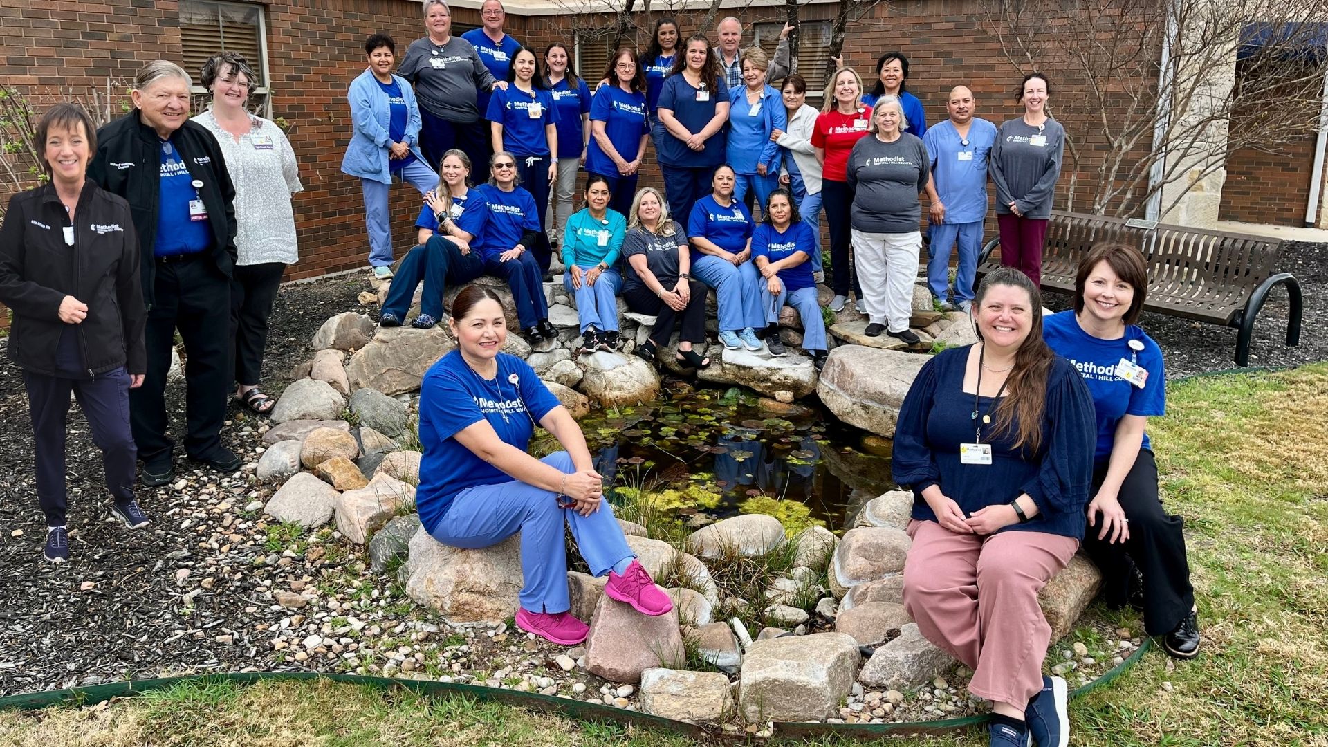 Methodist Hospital Hill Country hospice team gather outside the hospice unit for a photograph.