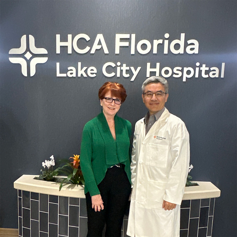 Fran Evans and Dr. Yi Wang in the lobby of HCA Florida Lake City Hospital.