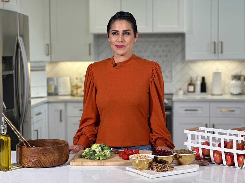 Brenda Macias prepares salad