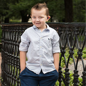 Liam Gordon posing next to a gate.