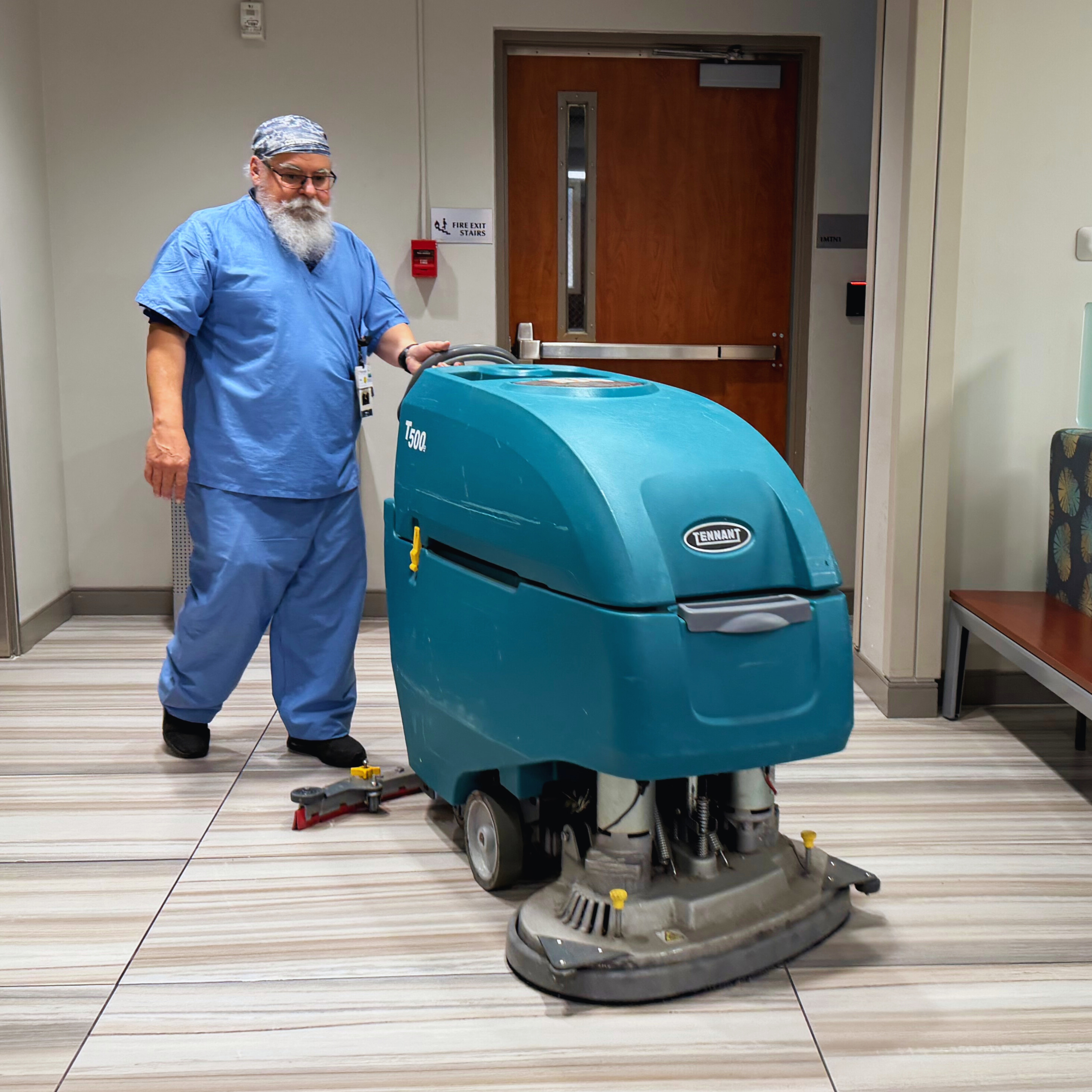 Albert Morales cleans the floors with a scrubber at Methodist Hospital Metropolitan
