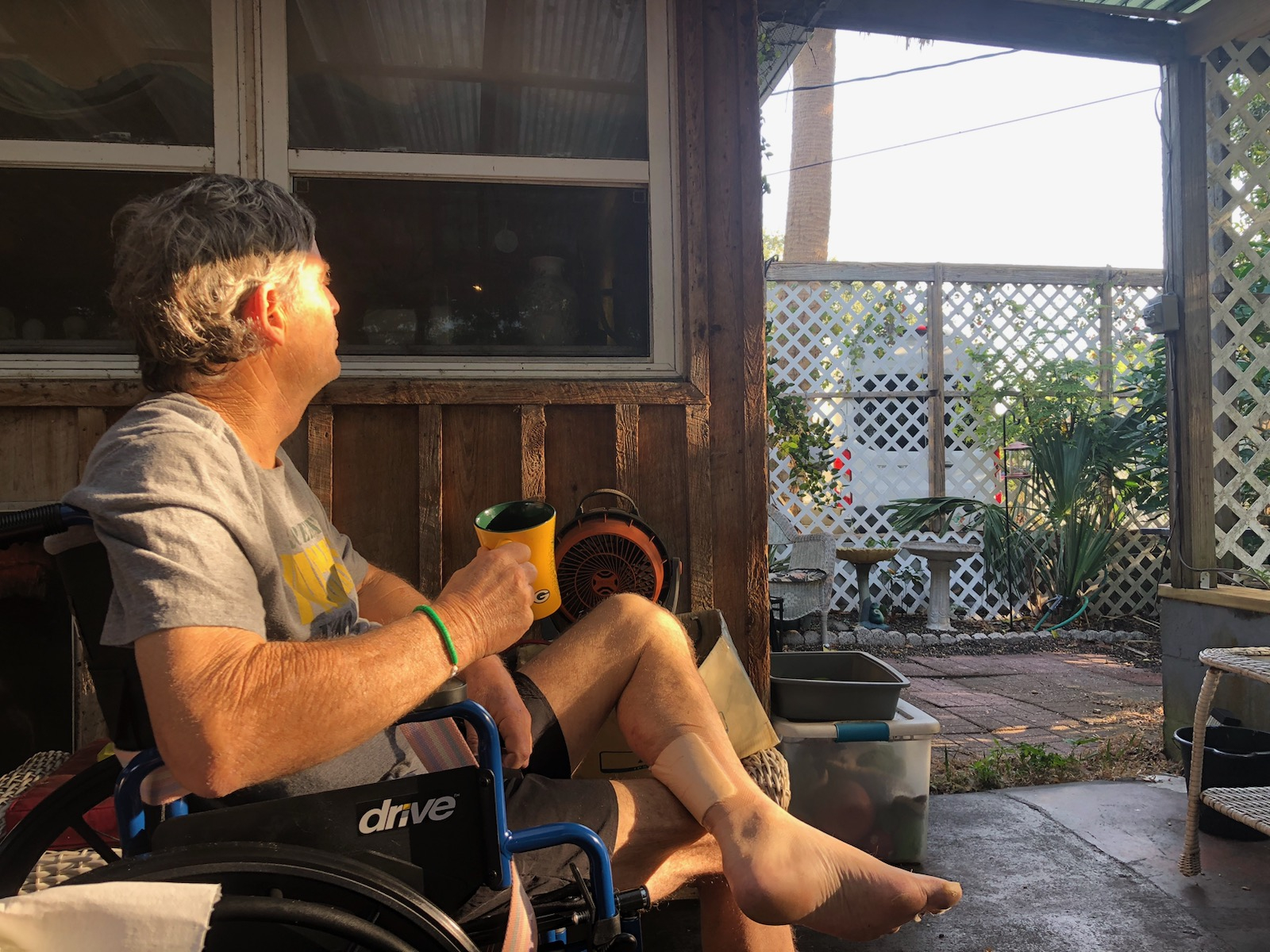 Michael Gaudet sitting on his porch.