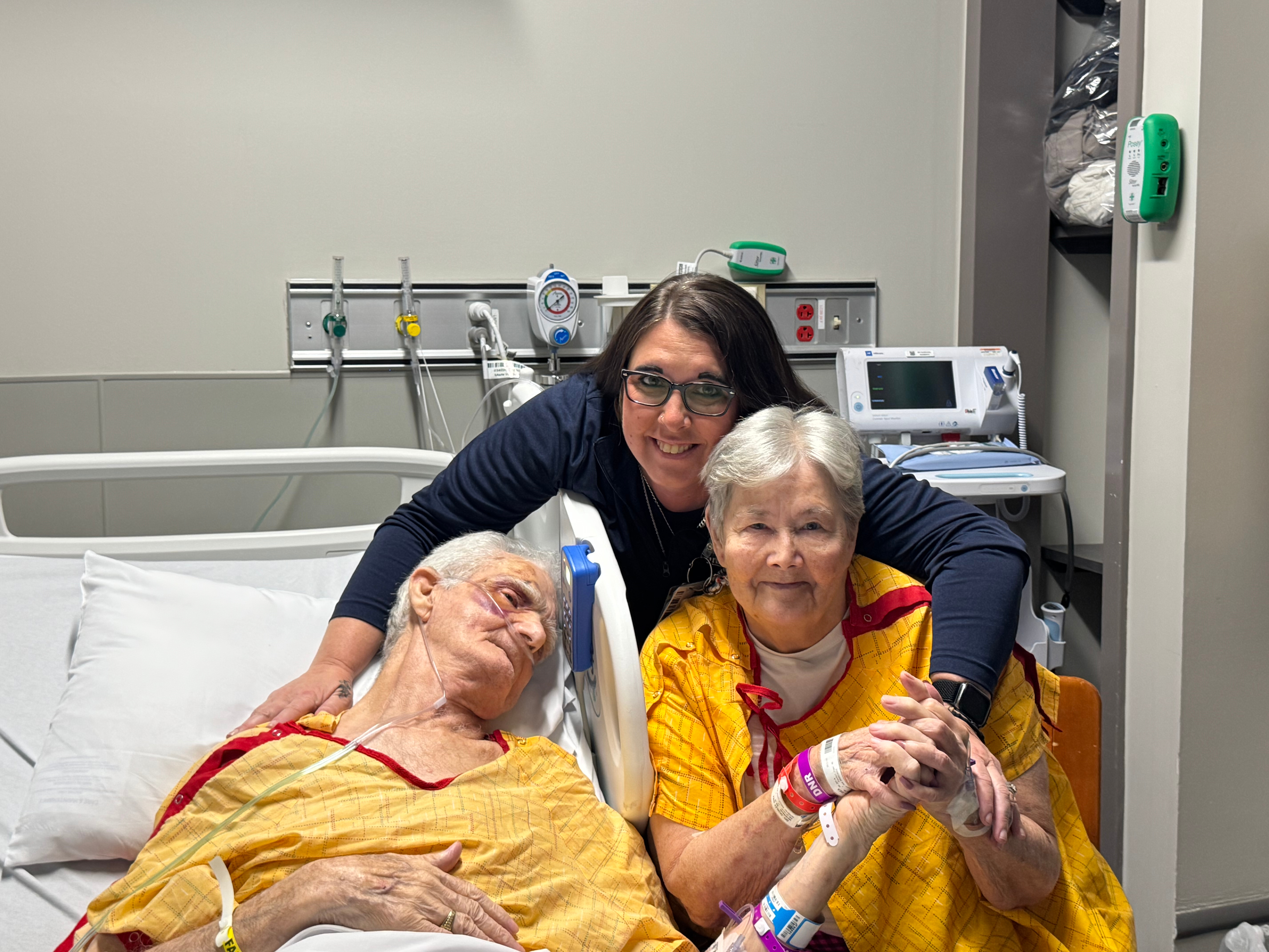 The group poses for a photo in the hospital.