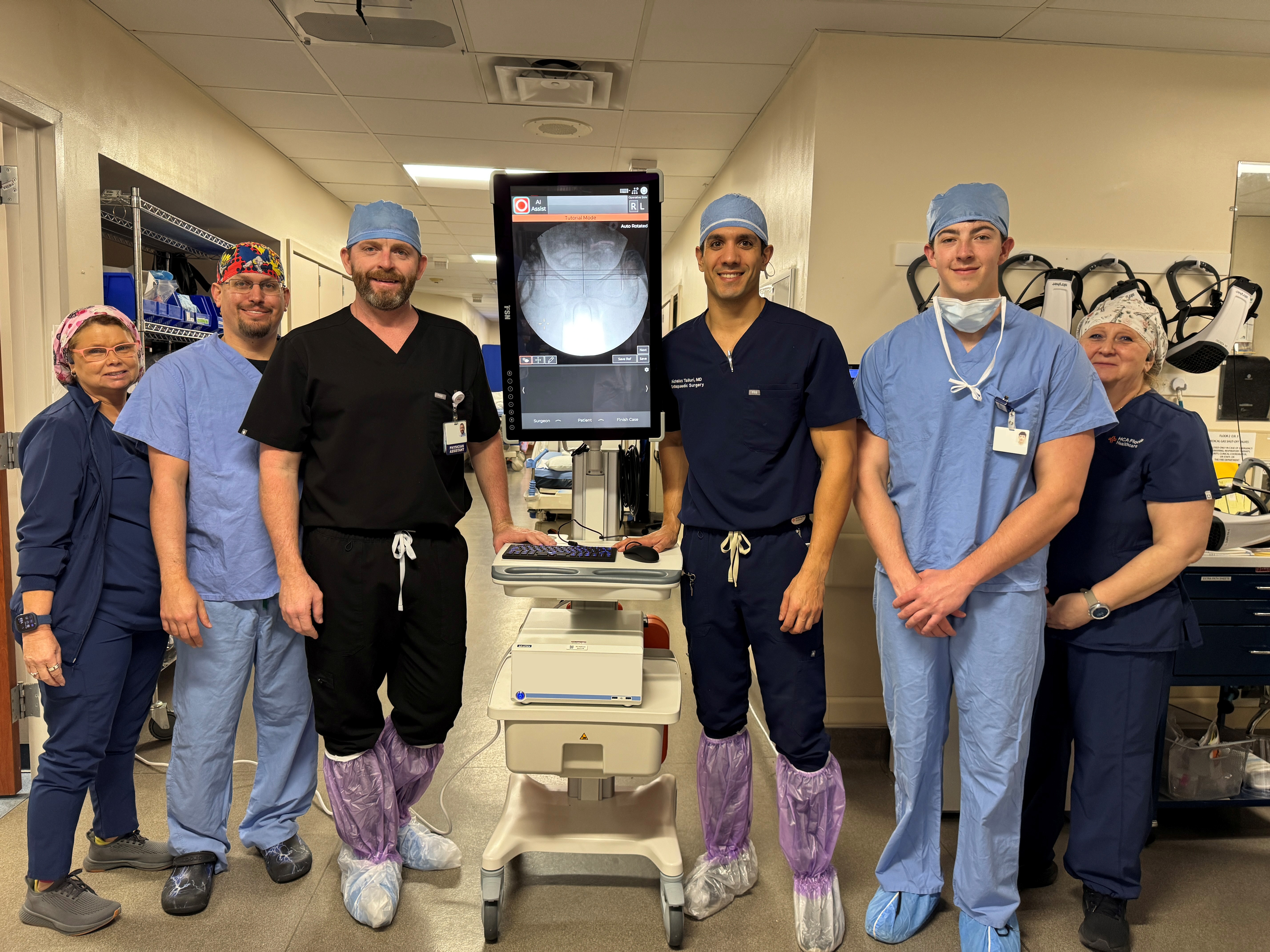 Dr. Talluri and his team celebrate with the new minimally invasive surgery equipment.