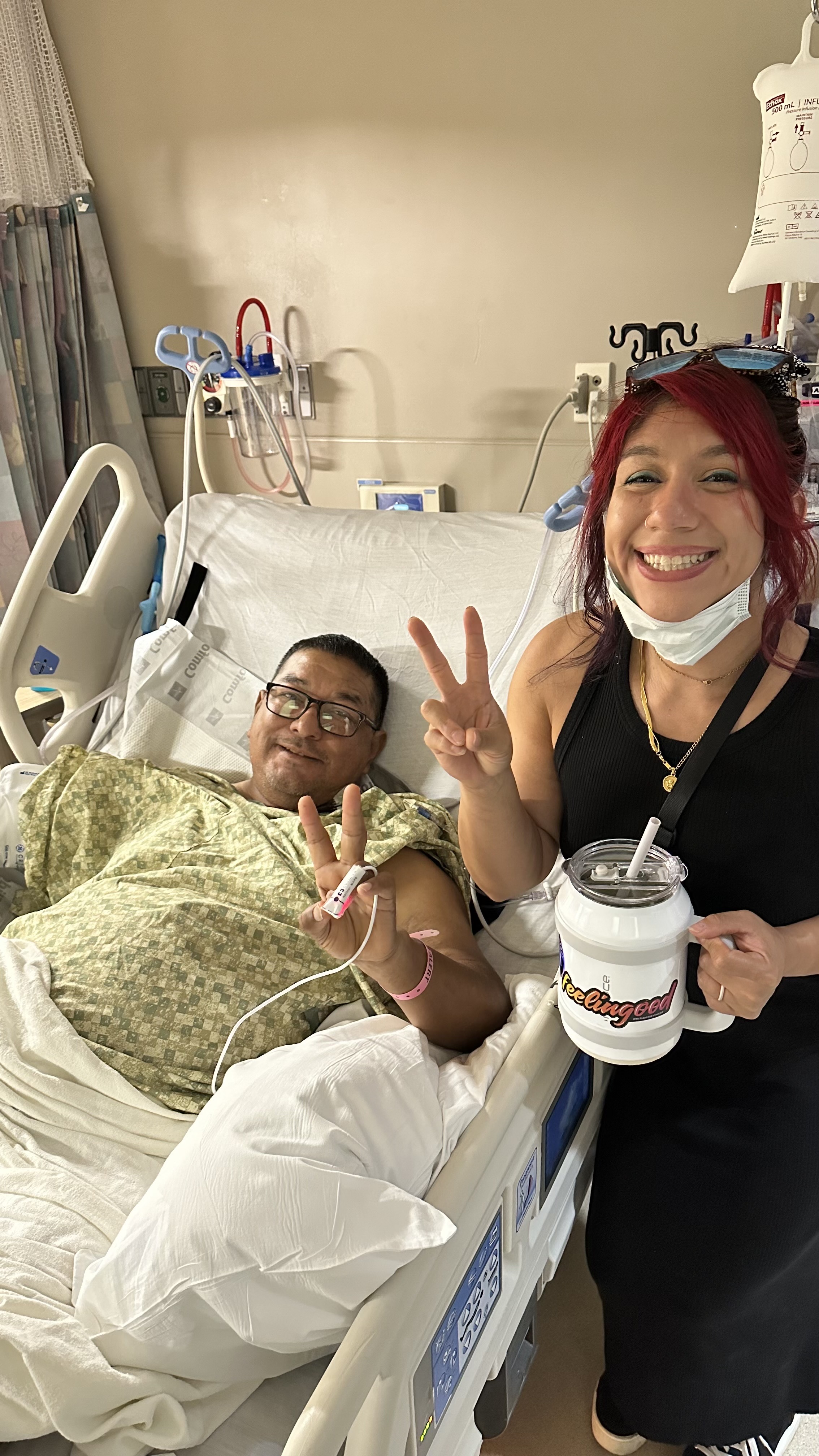 Juan Vasquez, patient, pre-op with his daughter in the hospital room. 