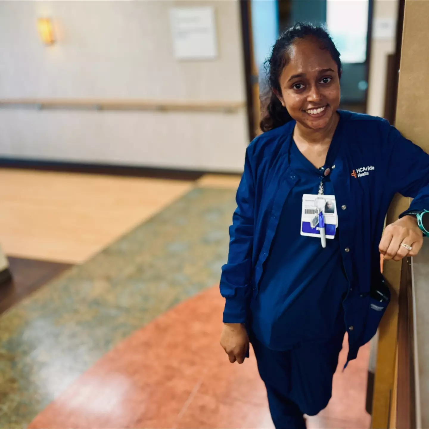 Jasmine Love in scrubs at the hospital.