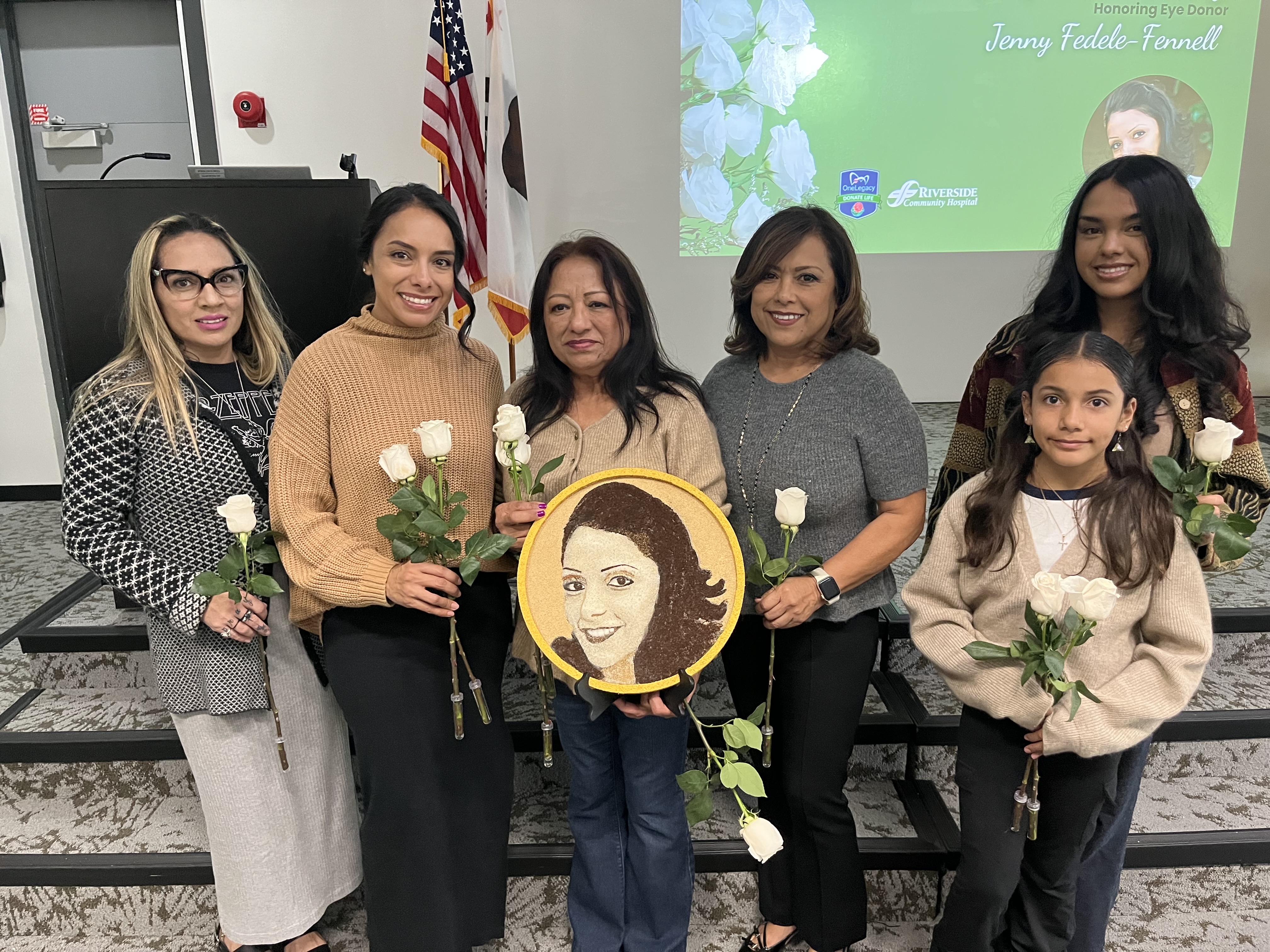 Fedele-Fennell Family holding the floragraph.