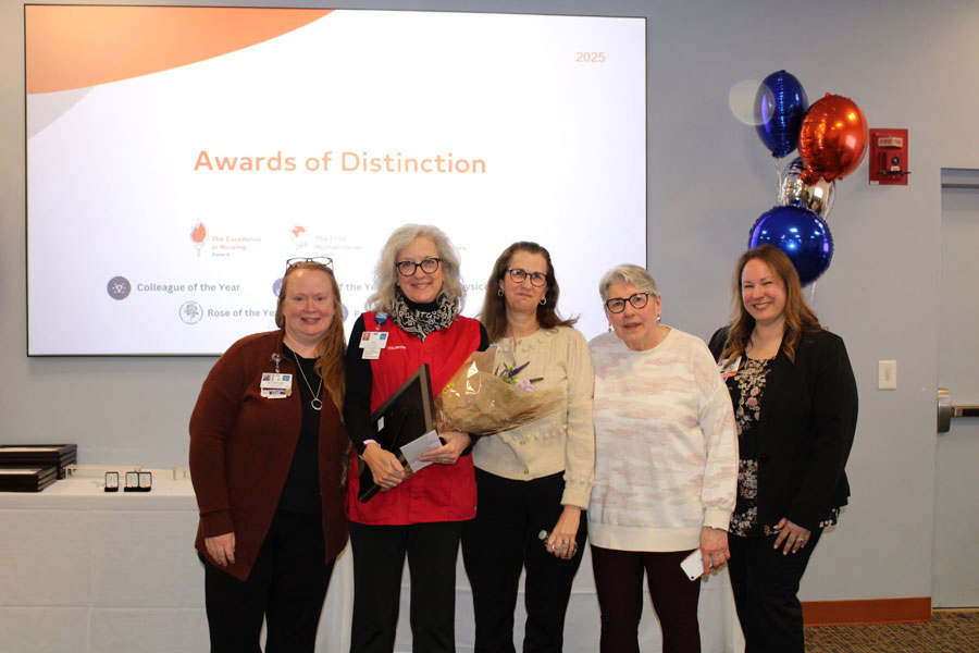 Portsmouth volunteer Julie Ogilvie posing with colleagues after receiving the Frist Humanitarian - Volunteer Award.