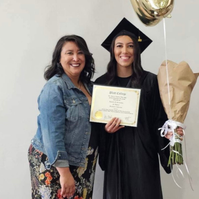 Maria and daughter, Bella, in her graduation cap and gown.