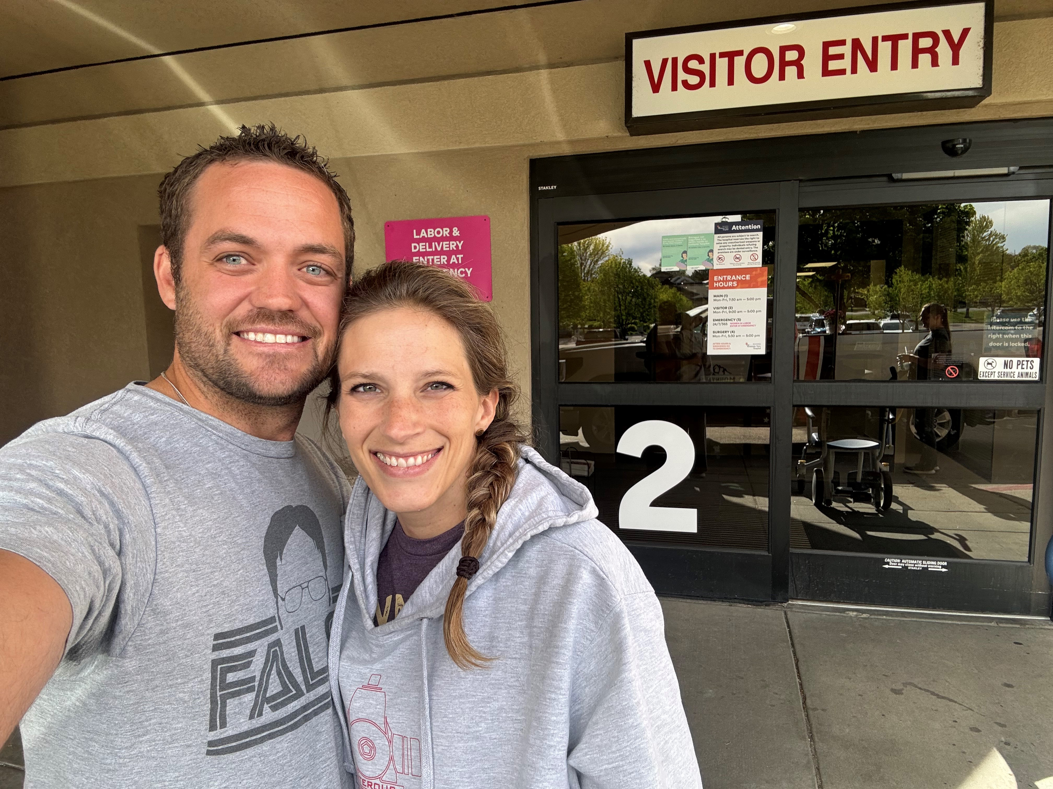 Justine and Kevin Carter pose outside a hospital.